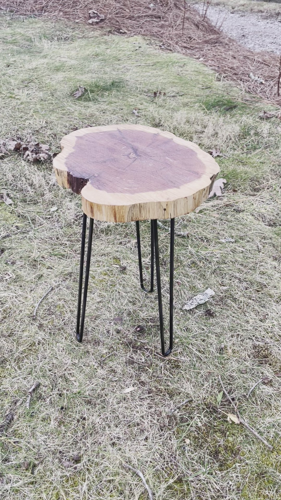 The side table pictured is made from hand-shaped metal hairpin legs and a handmade live edge cedar slab with a food safe finish. 
